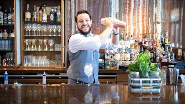 Omni bartender making a drink Omni bartender making a drink