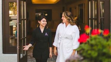 Omni employee and guest departing the spa Omni employee and guest departing the spa