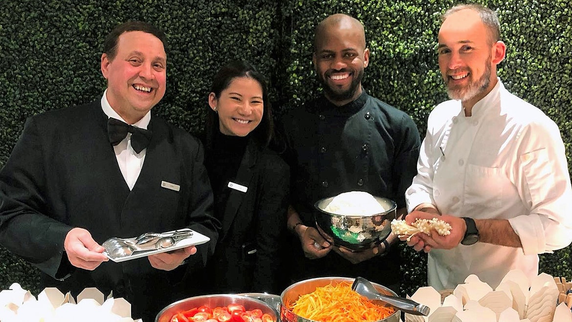 Chefs showing food.